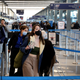 People go through TSA screening as they catch flights at O’Hare International Airport on March 11, 2022, in Chicago, Illinois.